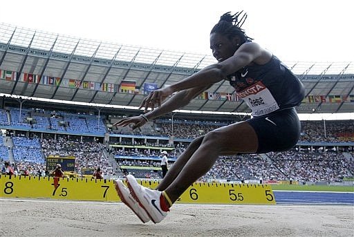 Brittney Reese of the United States in action on her way to winning the gold medal as she competes in the final of the Women&#039;s long jump during the World Athletics Championships in Berlin on Sunday, Aug. 23, 2009. (AP Photo/Matt Dunham)