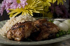 **ADVANCE FOR FRIDAY  APRIL 24** **FOR USE WITH AP LIFESTYLES**  Peanut butter-chutney barbecued chicken is seen in this Sunday April 12, 2009 photo. This flavorful Peanut Butter-chutney Barbecued Chicken keeps flavor up while reducing fat by serving it skinless. Using bone-in thigh pieces help keep the chicken moist and tender. (AP Photo/Larry Crowe)