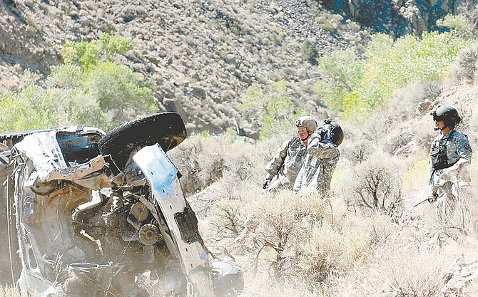 Nevada National Guard members performed a training exercise Friday that included the removal of 20 illegally dumped cars from the Carson River.