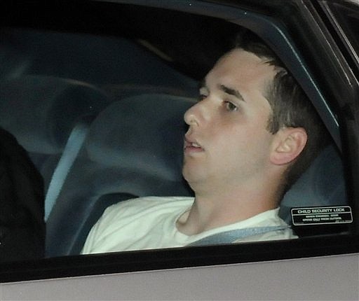 Raymond Clark III, 24,  is driven away from an apartment building by police on Tuesday Sept. 15, 2009 in Middletown, Conn. Police released the Yale University animal research technician early Wednesday after collecting DNA samples and questioning him in the killing of graduate student Annie Le who worked in the same lab. (AP Photo/The Hartford Courant, John Woike) MANDATORY CREDIT