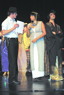 Nevada AppealJake Linstrom, left, playing Lt. Dan Morrow, questions Yadira Duarte as Isis, and Macauley Williams as Dr. Amun, during rehearsal Tuesday for the Carson High School&#039;s Capital Stars production of &quot;Oh Horrors! It&#039;s Murder!&quot; The audience-participation murder mystery opens Friday at the Carson Community Center.