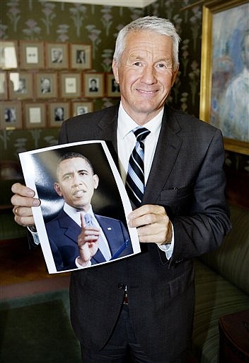 Chairman of the Norwegian Nobel Committee, Thorbjoern Jagland, holds a picture of US President Barack Obama,  in Oslo, Norway, Friday, Oct. 9, 2009, after the announcement of Obama as winner of the 2009 Nobel Peace Prize. The citation for the award, in part says, The Norwegian Nobel Committee has decided that the Nobel Peace Prize for 2009 is to be awarded to President Barack Obama for his extraordinary efforts to strengthen international diplomacy and cooperation between peoples. The Committee has attached special importance to Obama&#039;s vision of and work for a world without nuclear weapons. (AP Photo / Jon-Michael Josefsen, Scanpix) ** NORWAY OUT **