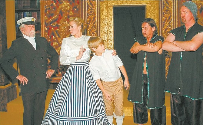 Submitted PhotoJohn Vettel, left, as Captain Orton, Sarah Pennebaker as Anna, Ryan Vettel as Louis, and guards Nick Faver and Ram Stembridge, rehearse a scene from the Western Nevada Musical Theatre Company&#039;s &quot;The King and I,&quot; opening Saturday.