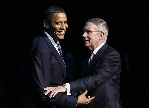 FILE - In this file photo taken  May 26, 2009, President Barack Obama stands with Senate Majority Leader Harry Reid, D-Nev., at a fundraising event in Las Vegas . Reid, already airing TV ads for an election that&#039;s more than a year away, tells voters he has the clout to make a difference in their lives. But even in Searchlight, Nev., where Reid is celebrity and neighbor, there are complaints about his politics and personality that mirror polls showing the most powerful Democrat in the Senate is not necessarily a hero at home. (AP Photo/Charles Dharapak, File)