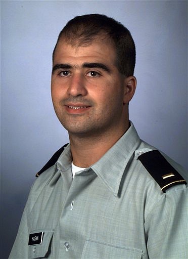 FILE - This 2000 file picture provided by the Uniformed Services University of the Health Sciences shows Nidal Malik Hasan when was a medical student at the F. Edward Hebert School of Medicine, Uniformed Services University of the Health Sciences. Majpr Hasan, accused in the Fort Hood shootings, was charged with 13 counts of premeditated murder in the military&#039;s legal system Thursday, Nov. 12, 2009, making him eligible for the death penalty if convicted, officials said. (AP Photo/Uniformed Services University of the Health Sciences, file)