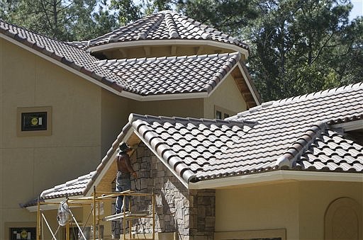 In this Oct. 21, 2009 photo, a new home under construction in Tallahassee, Fla., is shown. Construction of new homes unexpectedly plunged last month, as builders waited to see whether lawmakers would extend a tax credit for homebuyers.(AP Photo/Phil Coale)