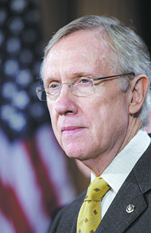**ADVANCE FOR MONDAY, DEC. 7** FILE - This Nov. 18, 2009 file photo shows Senate Majority Leader Sen. Harry Reid, D-Nev., pausing during a news conference on health care reform on Capitol Hill in Washington. Reid is a supporter of a federal program that began as a safety net for Pacific Northwest logging communities hard-hit by battles over the spotted owl in the 1990s that has morphed into a sprawling entitlement. Reid called the timber program a personal priority that supports &quot;the lifeblood of communities all across America, and particularly in the West.&quot; (AP Photo/Alex Brandon, File)