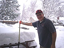 Michele LewisSteve Lewis measures the snow on the picnic table, which is on the protected side of the house on the west side of Carson City.