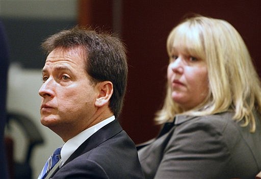 Nevada Lt. Gov. Brian Krolicki, left, and Kathy Besser appear in court, Tuesday, Nov. 24, 2009, in Las Vegas. A clerk said it will be next week before a Nevada judge rules whether to dismiss criminal charges accusing Krolicki and his top aide of mishandling a $3 billion state college savings program. (AP Photo/Las Vegas Review-Journal, John Locher) ** LAS VEGAS SUN OUT. MAGS OUT. NO SALES **