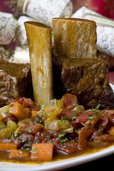 This Nov. 22, 2009 photo shows a slow cooked roast. A slow cooked roast like these stout-braised short ribs can help lower kitchen stress during this busy time of year. (AP Photo/Larry Crowe)