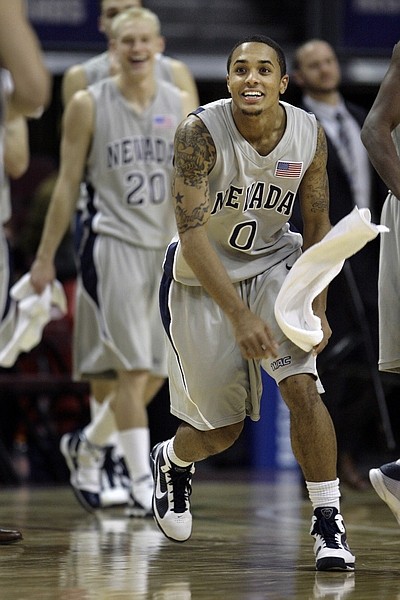 Nevada&#039;s Brandon Fields celebrates their 99-68 victory over Tulsa during an NCAA college basketball game in Las Vegas on Wednesday, Dec. 23, 2009. (AP Photo/Laura Rauch)