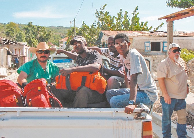 Randy Varain, far right) and Paul Melendrez ,far left return from a clinic in the field, traveling in 4x4 vehicle with their translators.