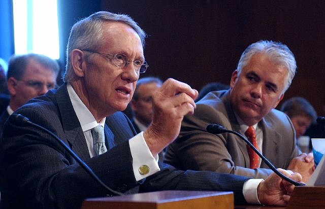 Senate Majority Leader Harry Reid, left, accompanied by Sen. John Ensign, R-Nev., addresses a Senate committee on Yucca Mountain in 2007.