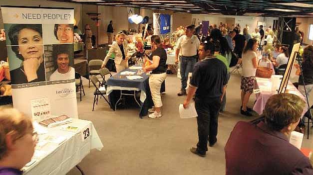 Kevin Clifford/Nevada AppealJob seekers crowd a job fair last October in Carson City.