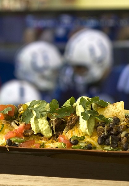 This photo taken Jan.17, 2010 shows nachos. Be sure your nacho offering at your Super Bowl gathering lives up to the hype of the game with these Super Nachos. (AP Photo/Larry Crowe)