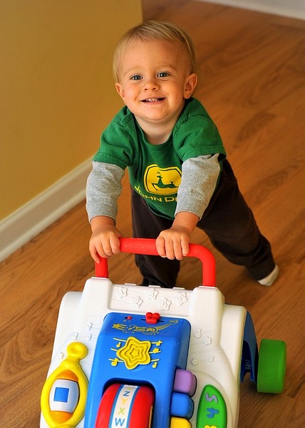 In this photo provided by the family, John Klor, then-16-months old, of Pine Knoll Shore, N.C., pushed a toy  in the photo taken Sept. 12, 2009.  At his first birthday, John Klor couldn&#039;t even sit up on his own. Three months later, he was cruising like a normal toddler _ when a lucky break finally diagnosed the North Carolina boy&#039;s mysterious disease.  (AP Photo/Klor Familt. HO)