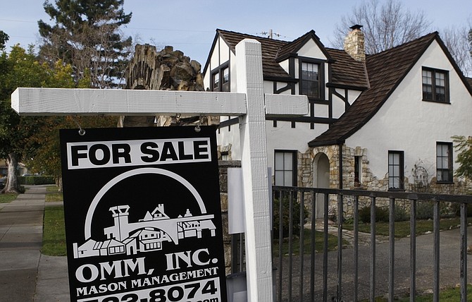 In this Jan. 5, 2010 photo, a home is seen advertised for sale in Alameda, Calif. Sales of previously occupied homes took the largest monthly drop in more than 40 years last month, plunging far more than expected after lawmakers gave buyers more time to use a tax credit.(AP Photo/Ben Margot)