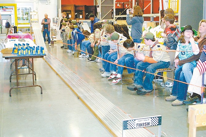Photos by Sandi Hoover/Nevada AppealHere they come! Above, all eyes are focused on the starting line during Cub Scout Pack 341&#039;s Pinewood Derby Saturday at Home Depot in north Carson City.