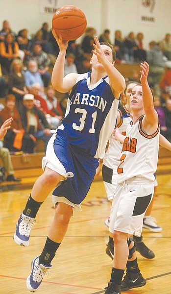 Shannon Litz/Nevada Appeal News ServiceCarson&#039;s Gina Bianchi goes up for a shot Friday as Douglas&#039; Jackie Harper looks on.