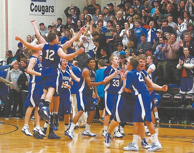 Shannon Litz/Nevada Appeal News ServiceThe Carson boys basketball team celebrates its 55-50 win over its archrival Douglas on Friday night in Minden.