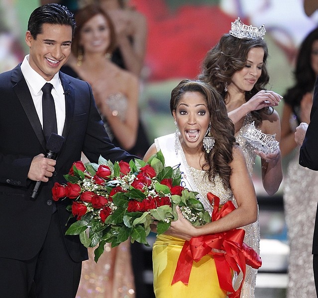 Host Mario Lopez watches Miss Virginia Caressa Cameron react after being crowned Miss America by Katie Stam Miss America 2009, Saturday Jan. 30, 2010 at The Planet Hollywood Resort &amp; Casino in Las Vegas. (AP Photo/Eric Jamison)