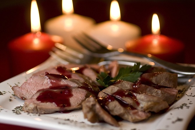 This photo taken Jan. 14, 2010 shows roasted duck. Treat your valentine to a meal that is both luxurious and healthy by making this roasted duck breast with savory plum sauce.  (AP Photo/Larry Crowe)