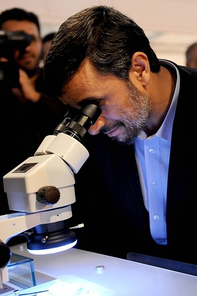 Iranian President Mahmoud Ahmadinejad, uses a microscope he visits an exhibition of Iran&#039;s laser science, in Tehran, Iran, Sunday, Feb. 7, 2010. Ahmadinejad ordered his country&#039;s atomic agency on Sunday to begin the production of higher enriched uranium, a move that&#039;s likely to deepen international skepticism about the country&#039;s real intentions on the crucial issue of enriched uranium. (AP Photo/ISNA,Hamid Foroutan)