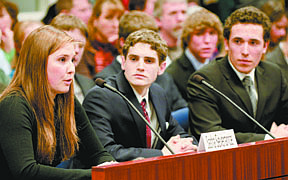 Incline HIgh School seniors (from r to l) Jimmy Sagan and Michael Ceragioli watch as Sasha Severance answers questions during the state finals of the &quot;We the people&quot; competition today at the State Legislature.  Incline High School won the competition and will represent Nevada in the national competition in Washinton D.C. this April.