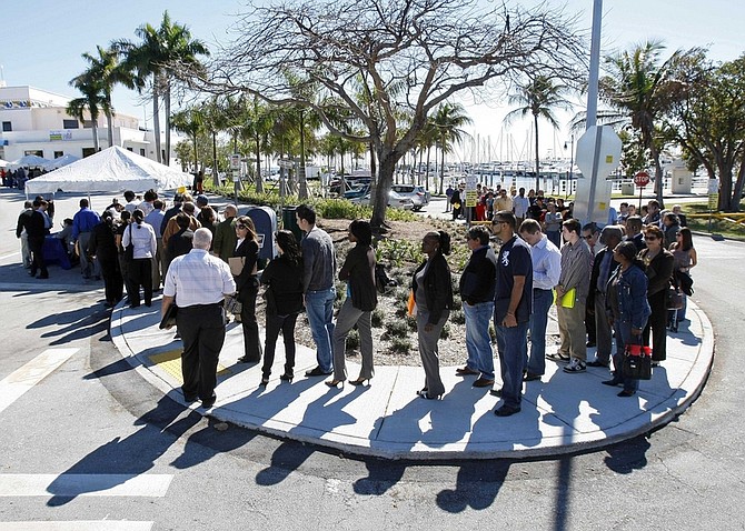 FILE - In this Jan. 26, 2010 file photo, job seekers line up to register at a City of Miami job fair in Miami. The outlook for jobs remains bleak despite January&#039;s unexpected decline in the unemployment rate, which fell to 9.7 percent from 10 percent in December.(AP Photo/Alan Diaz, file)
