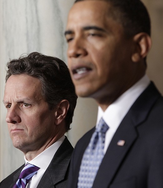 President Barack Obama, accompanied by Treasury Secretary Timothy Geithner, delivers a statement on his budget that he sent to Congress, Monday, Feb. 1, 2010, in the Grand Foyer of the White House in Washington. (AP Photo/Pablo Martinez Monsivais)