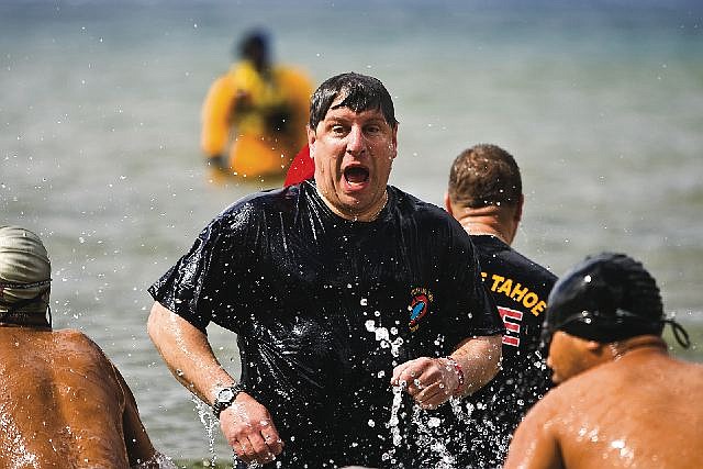 Jonah Kessel/Tahoe Daily TribuneA South Tahoe fireman rises from the frigid waters of Lake Tahoe at last year&#039;s Polar Plunge at Zephyr Cove. The event raises money for the Special Olympics Northern Nevada chapter.