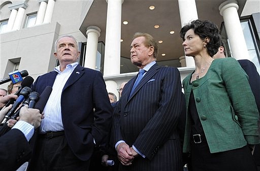 Nevada Gov. Jim Gibbons, left, on Sunday, Feb. 28, 2010 announces to the media that a budget agreement has been reached and that the special session of the legislature should wrap up later in the evening in Carson City, Nev. With him outside the Legislature Building in Carson City, Nev. is Senator Bill Raggio, R-Reno, and Assemblywoman Heidi Gansert, R-Reno. (AP Photo/Reno Gazette-Journal, David B. Parker)