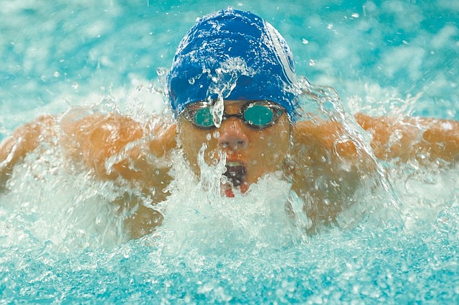 While doing the butterfly Carson&#039;s Jason Henderson swims the third leg of the 200 yard medley during a meet at Carson against Spanish Springs Friday, March 26, 2010.