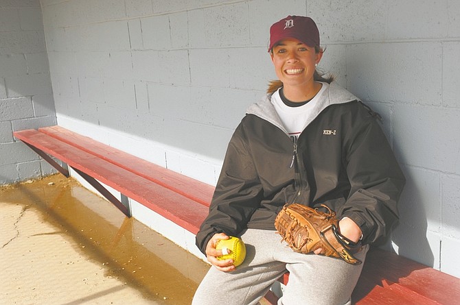 Dayton High School pitcher Mackenzie Cole, 17, injured her back last year but healed and is ready to lead the team this season. Cole poses in the dugout during a practice Thursday, March 25, 2010.