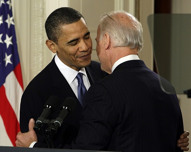 Vice President Joe Biden wispers &quot;This is a big f------ deal,&quot; to President Barack Obama after introducing The President during the health care bill ceremony in the East Room of the White House in Washington, Tuesday, March 23, 2010. (AP Photo/J. Scott Applewhite)