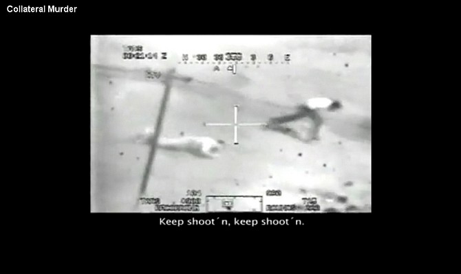This frame grab image taken from a video shot from a U.S. army Apache helicopter gun-sight, posted at Wikileaks.org and confirmed as authentic by a senior U.S. military official, two men in the streets of the New Baghdad district of eastern Baghdad after being fired upon by the helicopter July 12, 2007. Among those believed to be killed in the attack was Reuters photographer Namir Noor-Eldeen, 22, and his driver Saeed Chmagh, 40. Two children also were wounded. The official, who spoke on condition of anonymity because he was not authorized to speak publicly about the video, said the military could not confirm the identities of the Reuters employees in the film. According to U.S. officials, two helicopters arrived at the scene to find a group of men approaching the fight with what look to be AK-47s slung over their shoulders and at least one rocket-propelled grenade. A military investigation later concluded that what was thought to be an RPG was really a long-range photography lens; likewise, the camera looked like an AK-47. The text in the image appears in the video as it is posted on Wikileaks.org and includes some identifications, transcripts of the pilots communications and a title in the upper hand corner of the video.  (AP Photo/Wikileaks.org)