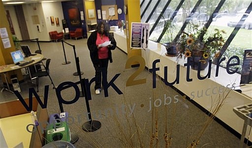 In this March 9, 2010 photo, Damashata Washington looks for work at Work 2 Future, a federally funded job training center, in San Jose, Calif. New claims for unemployment benefits fell more than expected last week as layoffs ease and hiring slowly recovers.(AP Photo/Marcio Jose Sanchez)