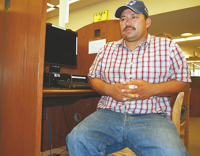 Brian Duggan/Nevada AppealJaime Ortiz, 33, is an out-of-work heavy machine operator who visits the Carson City Library two or three times a week to look at online job boards. The Nevada unemployment rate in March hit a new record at 13.4 percent.