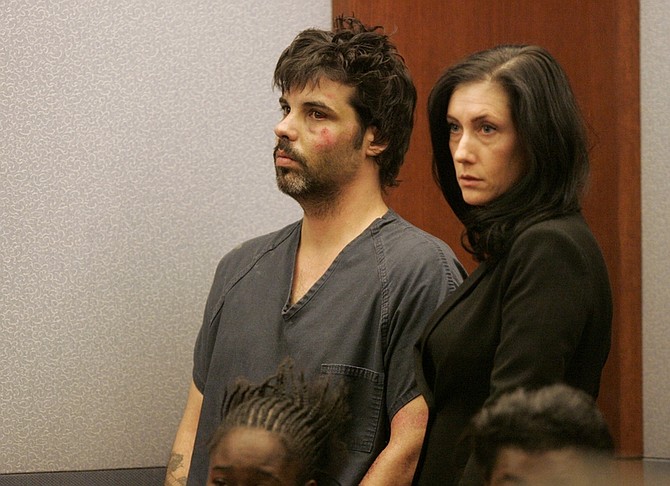Harold Montague, accused of killing a 4-month-old boy with an ax and severely injuring the child&#039;s mother, makes his first appearance in court with public defender Andrea Luem Tuesday, Feb. 16, 2010 in Las Vegas. (AP Photo/Las Vegas Sun, Sam Morris)