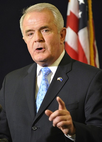 FILE  - In this Feb. 8, 2010 file photo, Nevada Gov. Jim Gibbons answers questions from reporters after delivering his state of the state speech in the Capitol building in Carson City, Nev. (AP Photo/Scott Sady, File)