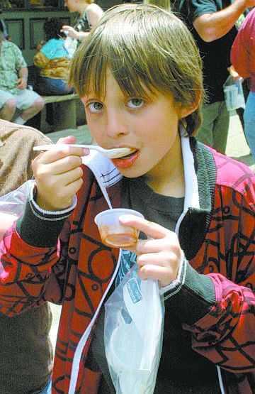  Sandi Hoover/Nevada AppealDean Poppenga, 9, of Carson City, samples a cup of chili Saturday in Virginia City during the 27th annual Chili on the Comstock Regional Cookoff. Hundreds of people filled turned out for the event.