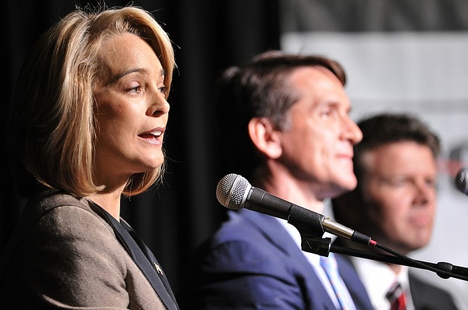 Nevada candidate  for the U.S. Senate seat currently held by Harry Reid, Sue Lowden answers a question as fellow candidates John Chachas, center and Chad Christensen wait their turn during the senatorial debate in Reno, Nev., Friday, April 23, 2010. (AP Photo/Scott Sady)