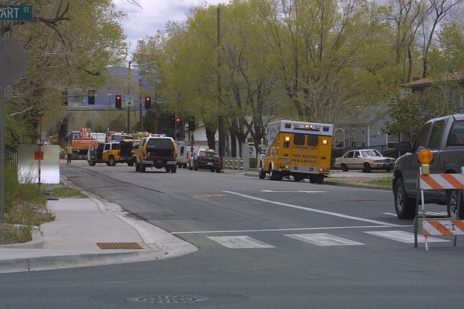 Emergency vehicles line Long Street between Roop and Stewart streets today after road construction crews hit a gas main. The surrounding homes were evacuated and crews are working to repair the leak.