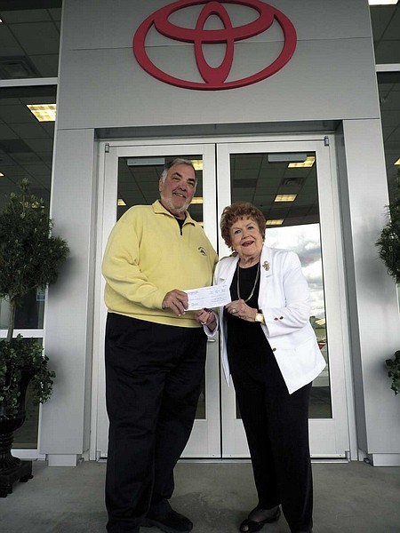 Brian Duggan/Nevada AppealJanice Ayres, of the Retired and Senior Volunteer Program, accepts a $5,000 check from Carson Toyota owner Dick Campagni on Thursday. The Carson City auto dealer gave the money for the RSVP&#039;s July 4 fireworks show.