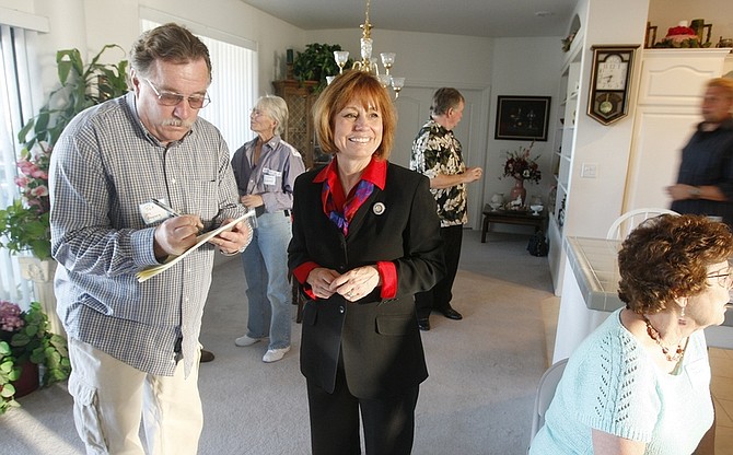 Sharron Angle, a Republican Senate candidate endorsed by the Tea Party Express, asks supporters to sign an email list at a home in Pahrump, Nev., Tuesday, May 18, 2010. The tea party conservative is testing the limits of anti-government sentiment, she&#039;s also the Republican on the rise in an unpredictable race to pick an opponent for Senate Majority Leader Harry Reid, a top Democrat in Washington in trouble at home.(AP Photo/Isaac Brekken)