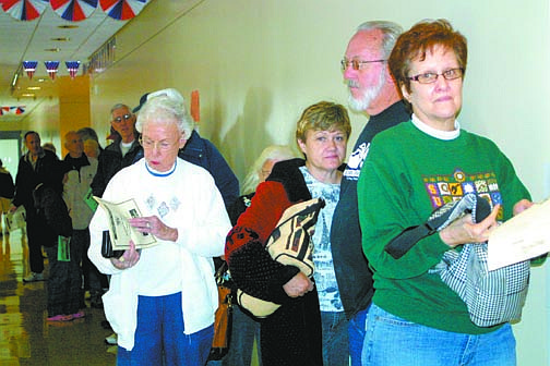 Sandi Hoover/Nevada AppealVoters line up inside the Carson City Courthouse Saturday morning to cast their votes. Clerk-Recorder Alan Glover said by the end of the day, about 450 residents had cast their ballots, which is way up from two years ago.