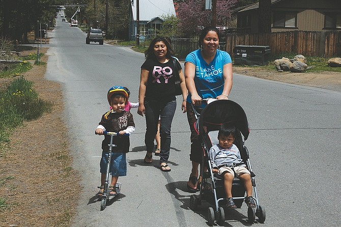 Jason Shueh/Nevada Appeal News ServiceFrom left to right, Gonzalo Barajas, age 3, Ere Garcia, Eva Castillo and her son George Castillo, age 2 head towards the Kings Beach main street. Walking directly behind is Cyanne Barajas, age 2, and Saiera Castillo.
