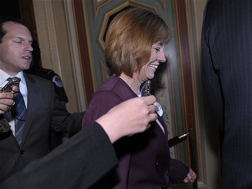 Nevada Republican Senate candidate Sharron Angle walks on Capitol Hill in Washington, Tuesday, June 15, 2010, as she leaves the Republican party policy luncheon. Angle is running against Senate Majority Leader Harry Reid. (AP Photo/Susan Walsh)