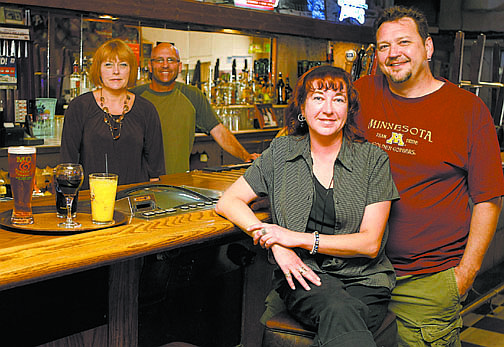 Shannon Litz/Nevada AppealMo &amp; Sluggo&#039;s Bar and Grill bar manager Linda Eisele, bartender Rowan Colgan, restaurant manager Jayme Watts and cook Tony Fish at the bar on Wednesday.
