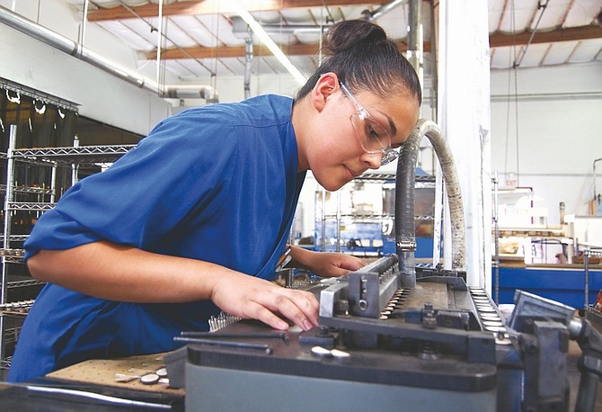 Brian Duggan/Nevada AppealYesenia Castillo  works on a batch of thermistors inside the manufacturing facility of Carson City&#039;s Ametherm Inc.